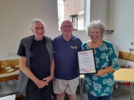 Alan Rockey is flanked by Ron Graham and Carole Kemp